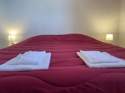 Un ou plusieurs lits dans un hébergement de l'établissement Punta di mare, appartements bord de mer