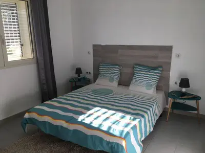 Un ou plusieurs lits dans un hébergement de l'établissement F2 REZ DE VILLA ENTRE MER ET MONTAGNE