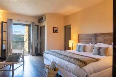 Un ou plusieurs lits dans un hébergement de l'établissement Hôtel Case Latine