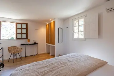 Un ou plusieurs lits dans un hébergement de l'établissement Hôtel Case Latine