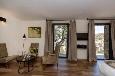 Coin salon dans l'établissement Hôtel Case Latine