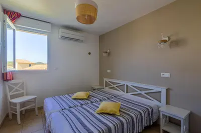 Un ou plusieurs lits dans un hébergement de l'établissement Maison Fab & Jo - Proche de lîle rousse