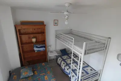 Un ou plusieurs lits dans un hébergement de l'établissement Calvi T3 climatisé 150 m plage