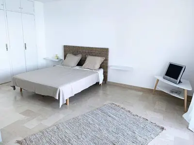 Un ou plusieurs lits dans un hébergement de l'établissement Appartement en bord de mer