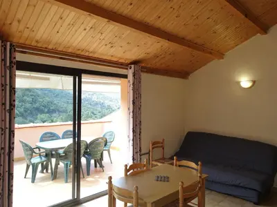 Coin salon dans l'établissement Apartment Residence Cabanaccia 3 Pieces 4 Pers by Interhome