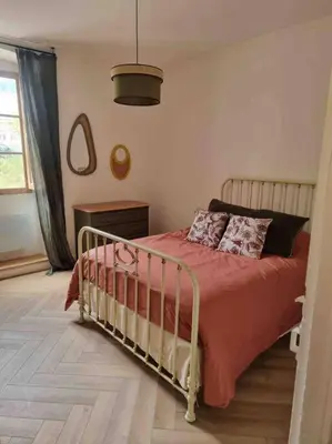 Un ou plusieurs lits dans un hébergement de l'établissement Appartement au cœur de la ville