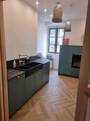 Cuisine ou kitchenette dans l'établissement Appartement au cœur de la ville