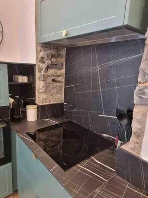 Cuisine ou kitchenette dans l'établissement Appartement au cœur de la ville