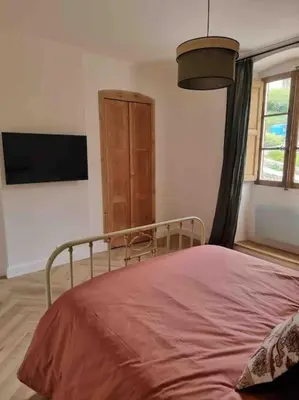 Un ou plusieurs lits dans un hébergement de l'établissement Appartement au cœur de la ville