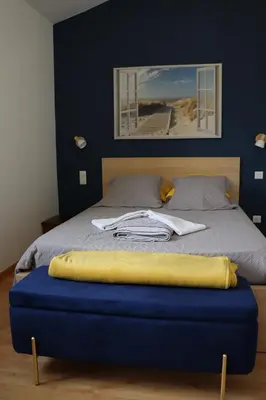 Un ou plusieurs lits dans un hébergement de l'établissement maison climatisée 150 m de la mer