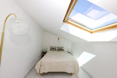 Un ou plusieurs lits dans un hébergement de l'établissement Appartement Azzurra
