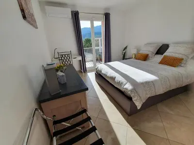 Un ou plusieurs lits dans un hébergement de l'établissement CAP CORSE VILLA VUE MER et MONTAGNE