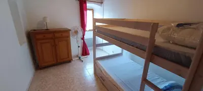Un ou plusieurs lits dans un hébergement de l'établissement Maison de village