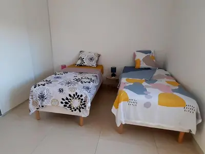 Un ou plusieurs lits dans un hébergement de l'établissement Bel appartement Corse côte Est