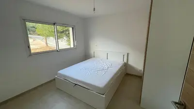 Un ou plusieurs lits dans un hébergement de l'établissement Calvi 2 pièces NEUF - vue mer piscine 18 m - proche plage - location par semaine complète