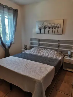 Un ou plusieurs lits dans un hébergement de l'établissement Rez Haut de villa à Calenzana