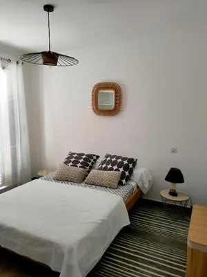 Un ou plusieurs lits dans un hébergement de l'établissement Jardin et 2 chambres centre St Florent