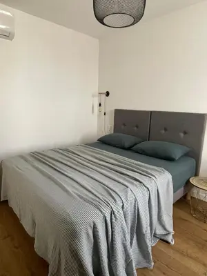 Un ou plusieurs lits dans un hébergement de l'établissement Appartement F3 Corte, centre ville
