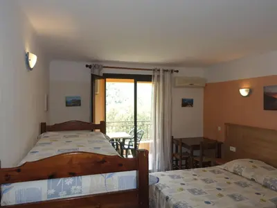Un ou plusieurs lits dans un hébergement de l'établissement Studio Residence Cabanaccia Studio 38m² by Interhome