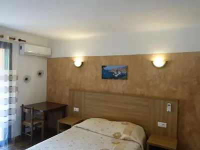 Un ou plusieurs lits dans un hébergement de l'établissement Studio Residence Cabanaccia Studio 35m² by Interhome