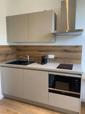 Cuisine ou kitchenette dans l'établissement Place Saint Nicolas - Centre Ville Bastia