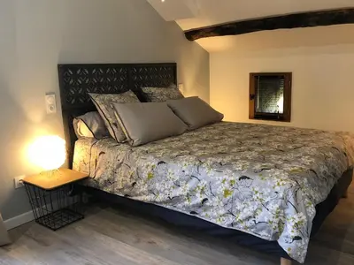 Un ou plusieurs lits dans un hébergement de l'établissement Appartements de Charme