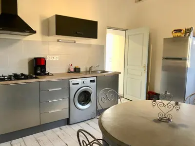 Cuisine ou kitchenette dans l'établissement Appartements de Charme