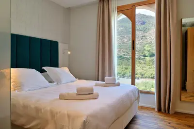 Un ou plusieurs lits dans un hébergement de l'établissement HOTEL SAINT ROCH