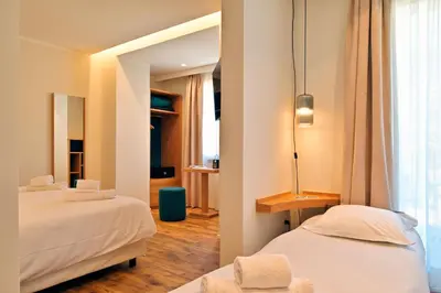 Un ou plusieurs lits dans un hébergement de l'établissement HOTEL SAINT ROCH
