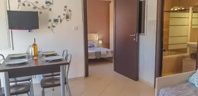 Un ou plusieurs lits dans un hébergement de l'établissement Joli appartement en Corse avec piscine