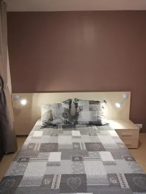 Un ou plusieurs lits dans un hébergement de l'établissement Joli appartement en Corse avec piscine