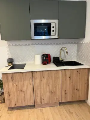 Cuisine ou kitchenette dans l'établissement Charmant studio