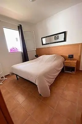 Un ou plusieurs lits dans un hébergement de l'établissement Casa Emma les pieds dans l'eau