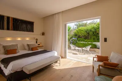 Un ou plusieurs lits dans un hébergement de l'établissement Hôtel La Caravelle