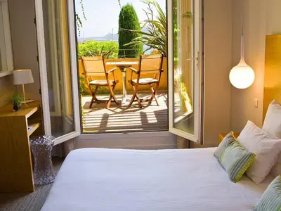 Un ou plusieurs lits dans un hébergement de l'établissement Hôtel La Caravelle