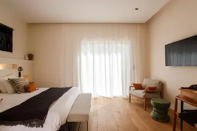 Un ou plusieurs lits dans un hébergement de l'établissement Hôtel La Caravelle