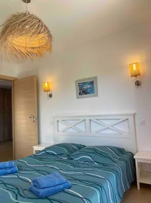 Un ou plusieurs lits dans un hébergement de l'établissement Saint-Florent Appartement duplex