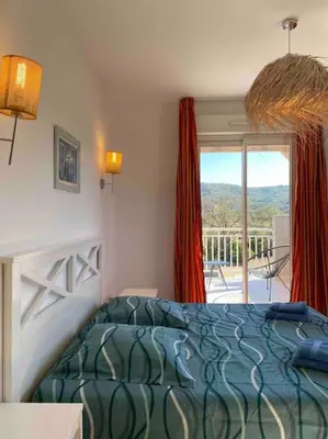 Un ou plusieurs lits dans un hébergement de l'établissement Saint-Florent Appartement duplex