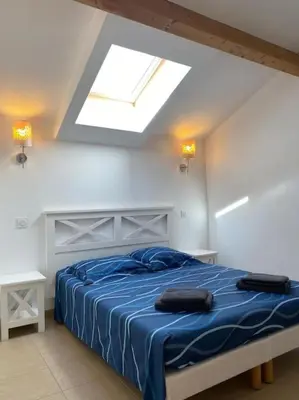 Un ou plusieurs lits dans un hébergement de l'établissement Saint-Florent Appartement duplex