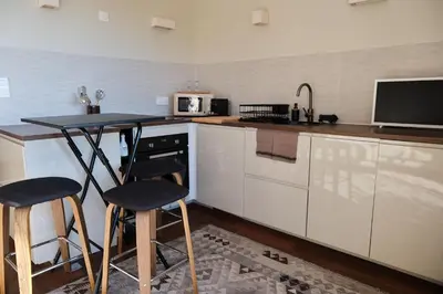 Cuisine ou kitchenette dans l'établissement Studio standing - Village Lumio