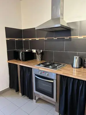 Cuisine ou kitchenette dans l'établissement Appartement 90 m2 proche de Corte