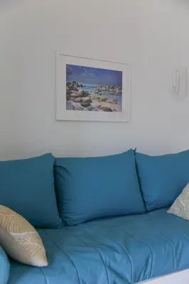 Coin salon dans l'établissement MAISONNETTE LOZARI 4 PERS PROCHE L'ILE ROUSSE