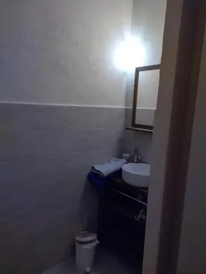 Salle de bains dans l'établissement Olivetu