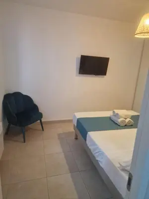 Un ou plusieurs lits dans un hébergement de l'établissement Residence Marina di Bravone