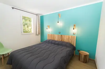 Un ou plusieurs lits dans un hébergement de l'établissement Vignale Resort