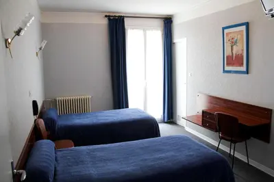 Un ou plusieurs lits dans un hébergement de l'établissement Hôtel Sampiero Corso