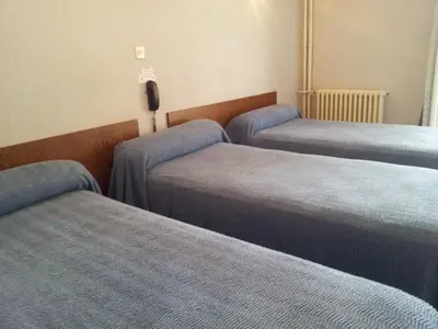 Un ou plusieurs lits dans un hébergement de l'établissement Hôtel Sampiero Corso