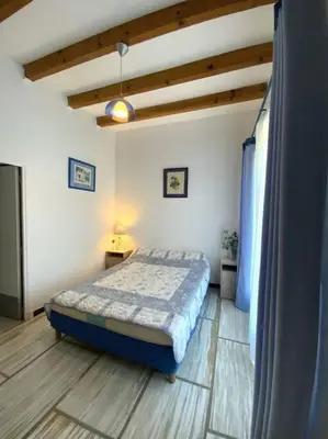 Un ou plusieurs lits dans un hébergement de l'établissement Appartement en rez de villa