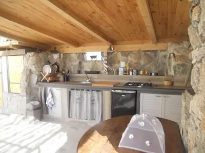 Cuisine ou kitchenette dans l'établissement SEJOUR DETENTE BALAGNE ENTRE MER ET MONTAGNE