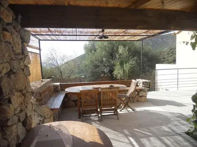 Balcon ou terrasse dans l'établissement SEJOUR DETENTE BALAGNE ENTRE MER ET MONTAGNE